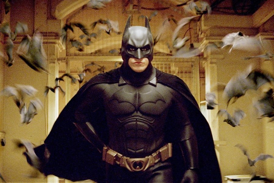 Batman Begins - 
 photo from https://thetigertribune.com/wp-content/uploads/2022/04/Batman-Begins-f677ee0.jpg
Wide shot of Christian Bale as Batman walking down corridor followed by colony of bats.